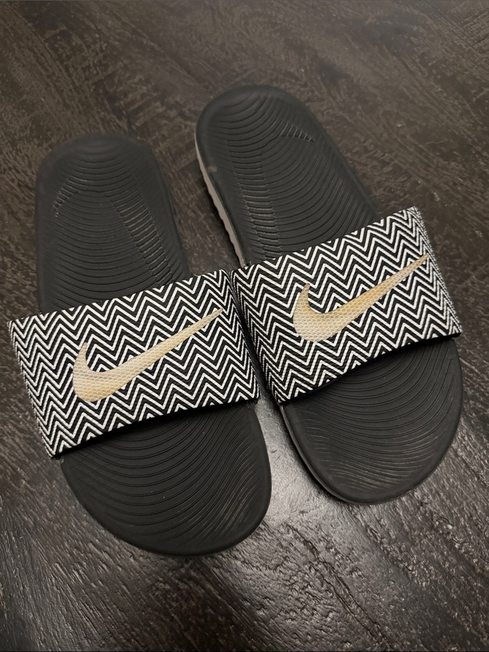 Nike Black Slide Sandals with Chevron Strap and Gold Swoosh